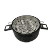 Barbecue de table au charbon en noir mat, équipé d'une grille en acier inoxydable.